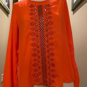 Orange blouse with beaded work on the front